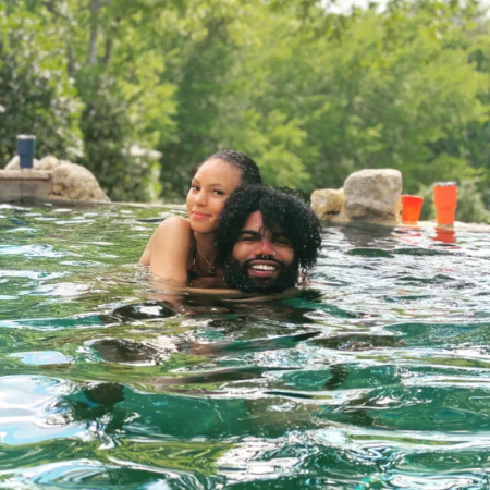 Ezekiel Elliott and his wife Halle Woodard swimming together