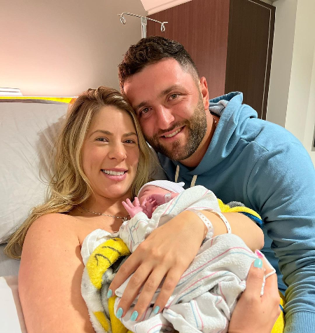 kelley cahill and jon rahm with their son