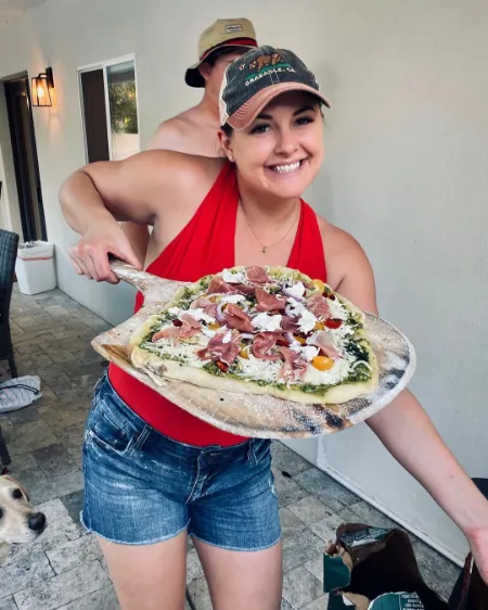 lona dahmen is making a pizza