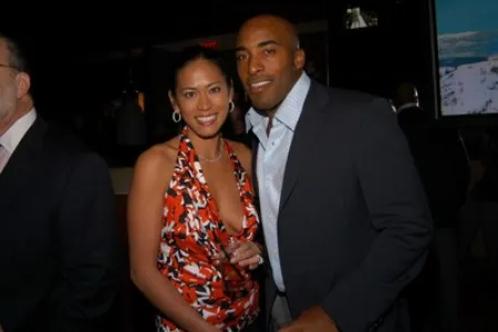 claudia patron with her husband ronde barber at a party