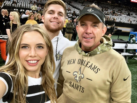 connar payton and meghan payton cheering their dad