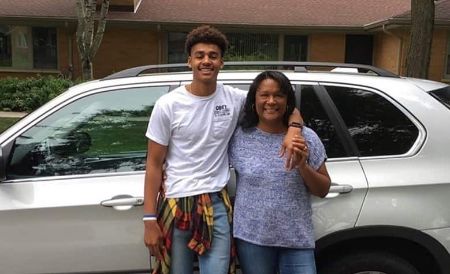 jordan poole with his mother manet poople huging