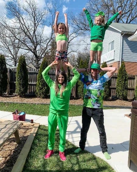 lyn-z adams honoring st Patrick’s day with travis pastrana and two daughter