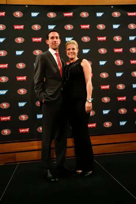 mandy shanahan with her husband kyle shanahan in an american football event