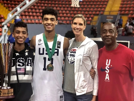 max christie with his parents celebrating