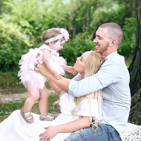 aj cole and christine cole with their daughter