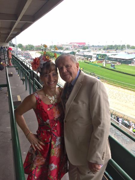 denny crum and susan sweeney watch horse racing