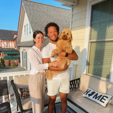 Jalen Brunson and Ali Marks with their dog